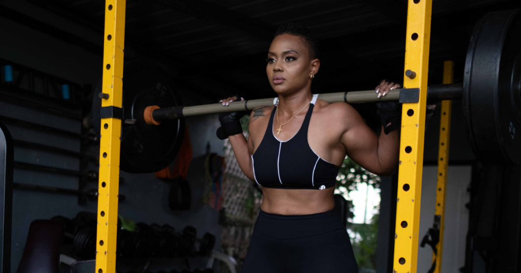 black woman exercising at outdoor gym