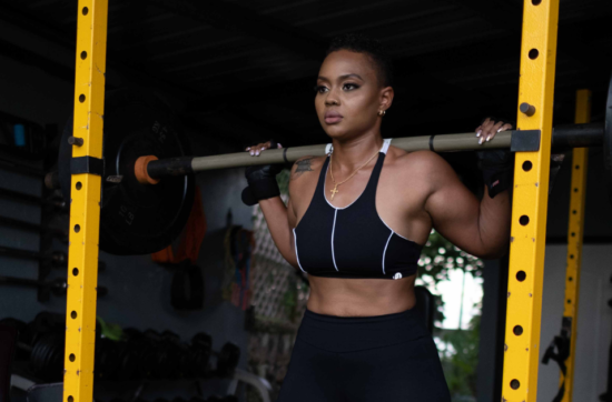 black woman exercising at outdoor gym